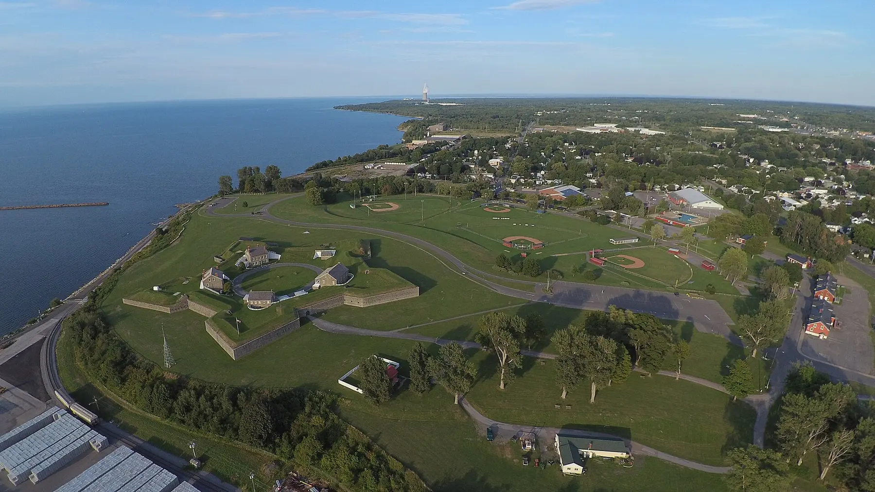 Aerial view of Fort Ontario's star-shaped grounds beside Lake Ontario